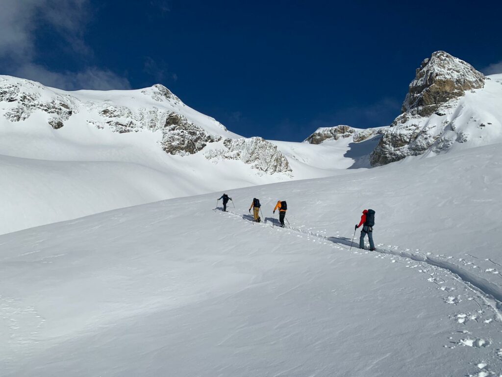Breaking trail for a splitboard skintrack in deep snow.  The Wilstrubel tour, April 2023 with The Rider Social